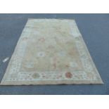 A Zeigler design middle eastern carpet with stylised flowers on a pale green ground, 240cm x