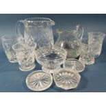 A quantity of mixed cut glass, including a water jug, various styles of glasses, tealight holders,