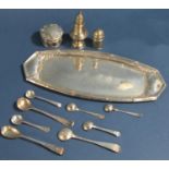 An Edwardian silver boat shaped dish with embossed detail and presentation script, to small pepper