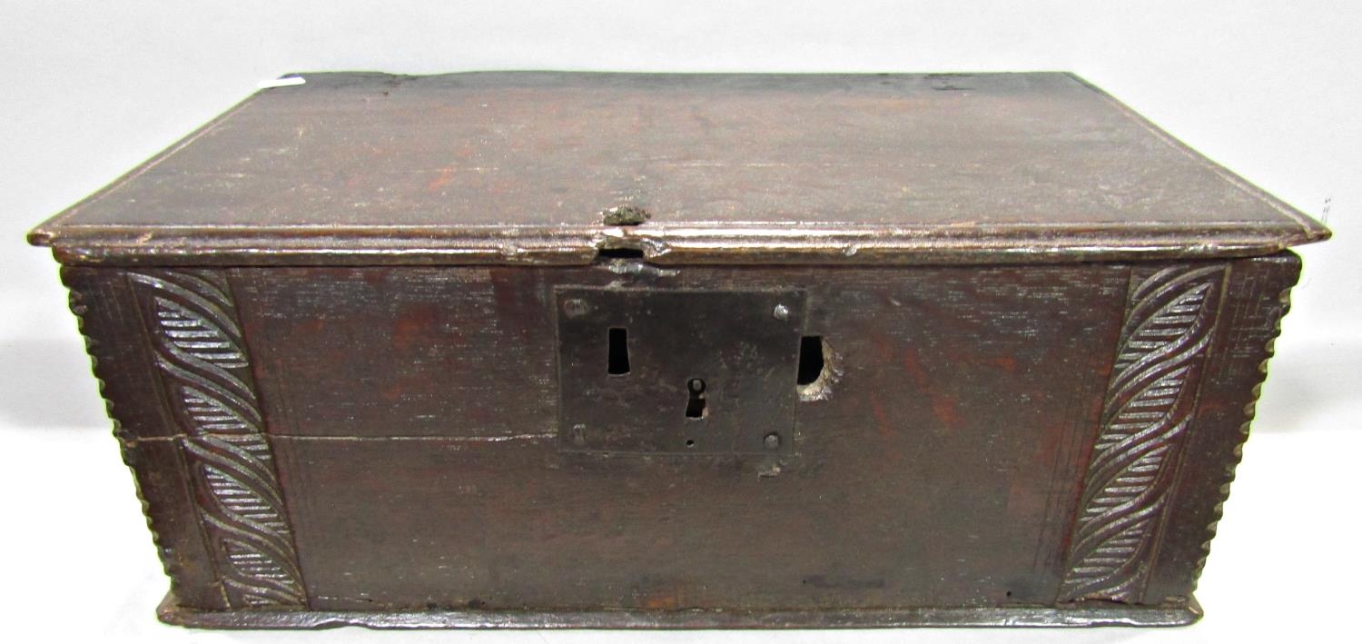 An 18th century oak bible box with steel lock plate with carved detail, a Japanese lacquered box