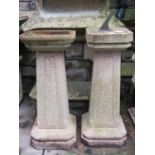 A weathered composition stone bird bath of square and canted form 81 cm high, together with a