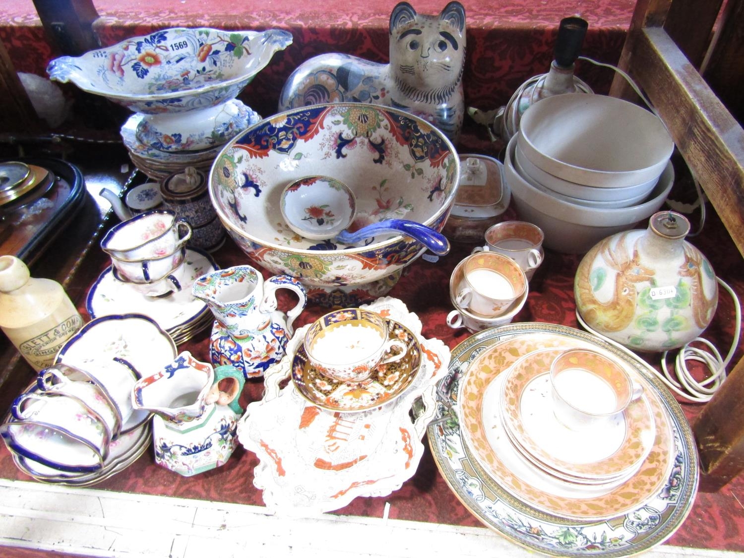 A collection of mainly 19th century china including ironstone plates, large punchbowl and ladle, two