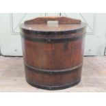 A Victorian steel banded coopered oak tub and cover, 49cm diameter, 42cm high