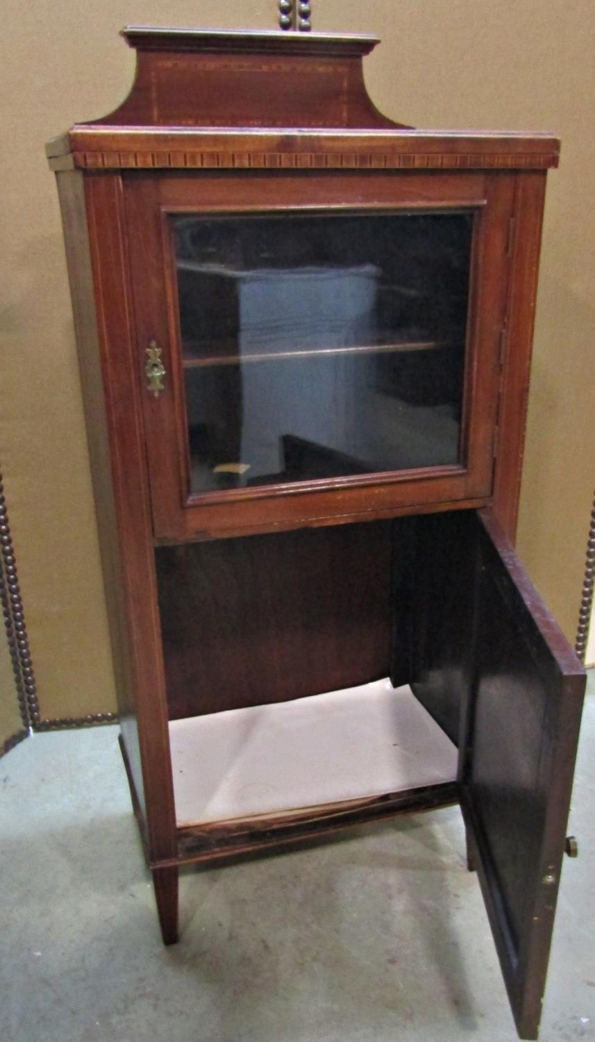 An inlaid Edwardian mahogany side/music cabinet enclosed by two panelled doors, the upper glazed, - Image 3 of 3