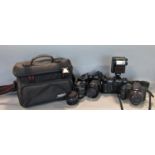 A Nikon JF-501 camera, a Lumix FZ100 and a Nikon D50 camera, with addiotnal lenses, etc