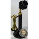 A vintage Bakelite candlestick telephone with brass receiver, re-wired for contemporary use, 32cm