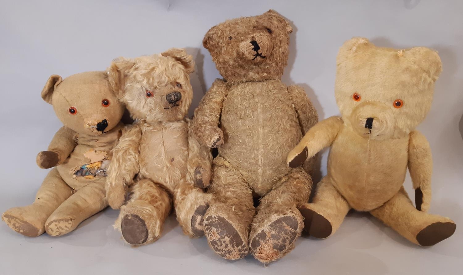 4 vintage teddy bears, all play worn including a tall firmly stuffed bear with stitched nose and