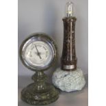 A Serpentine stone framed aneroid barometer and a further Serpentine stone table lamp in the form of