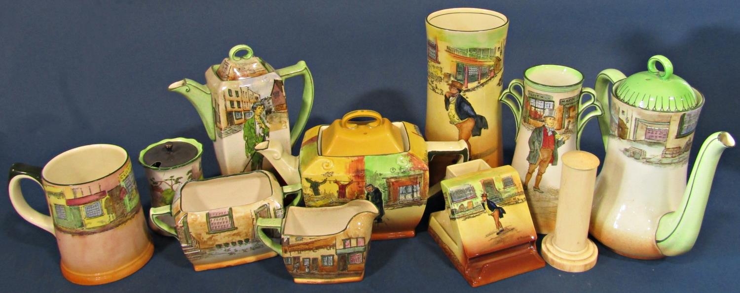 A collection of Royal Doulton Dickens ware comprising jardinière, vases, coffee pot, teapot, vesta