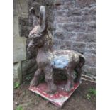 A cast composition stone garden ornament in the form of a standing donkey with painted finish and