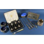 A cased set of six coffee spoons, two Victorian salt cauldrons, a silver beaker, a silver photo