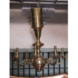 A cast brass hanging ceiling light with knopped stem and eight scrolling branches, 75 cm drop (af)