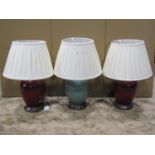 A pair of contemporary ceramic oviform table lamps with flambe type glaze complete with pleated