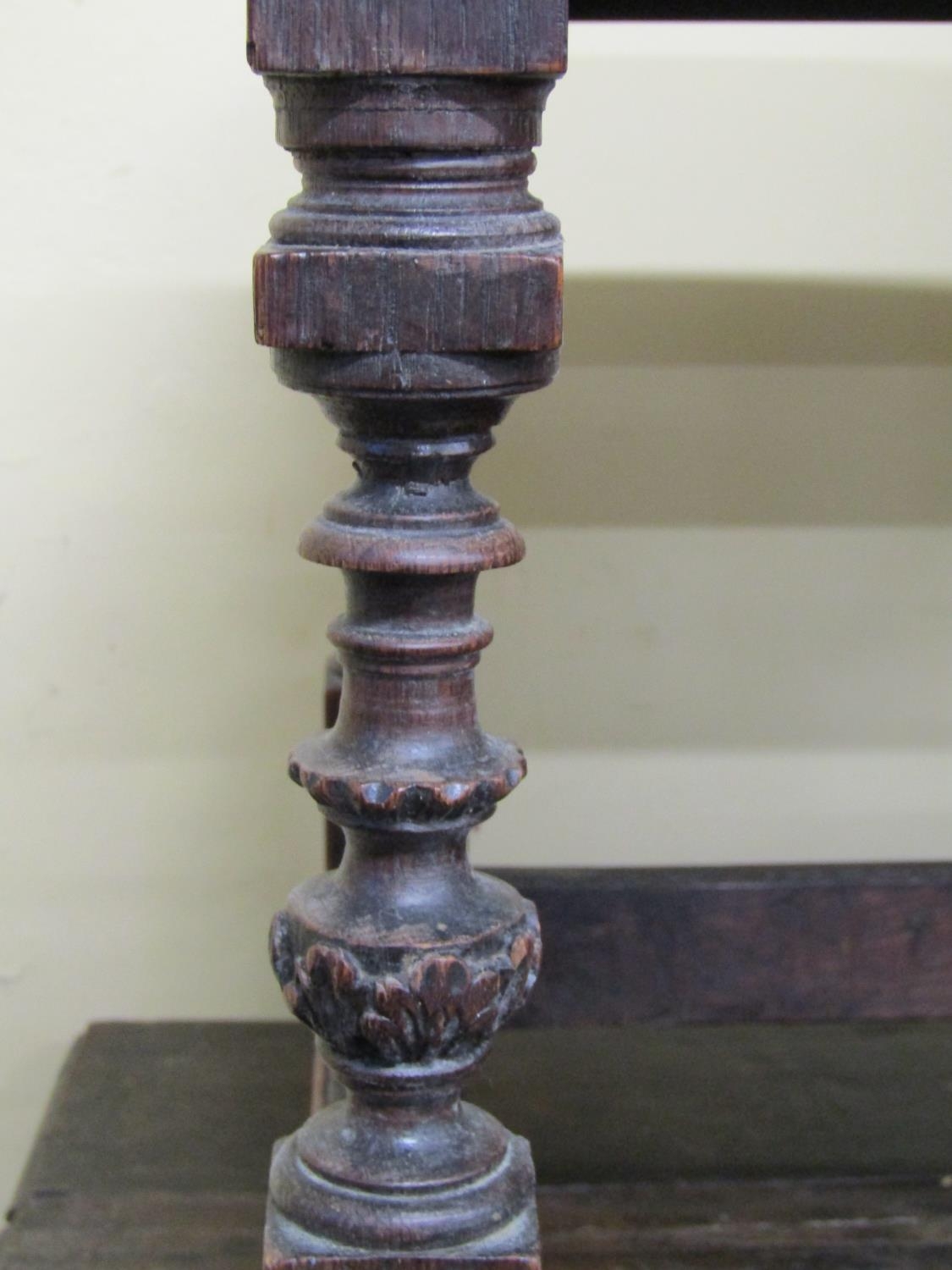 An antique oak stool with upholstered top raised on four turned and carved supports - Image 3 of 3