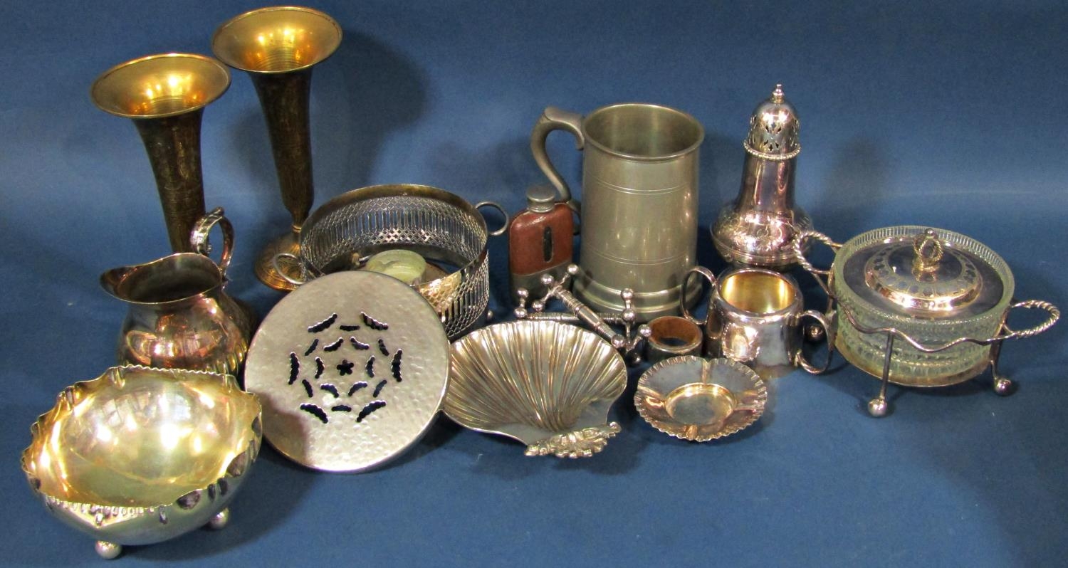 A miscellaneous collection of silver plated items including flatware, dishes, sugar bowl, milk