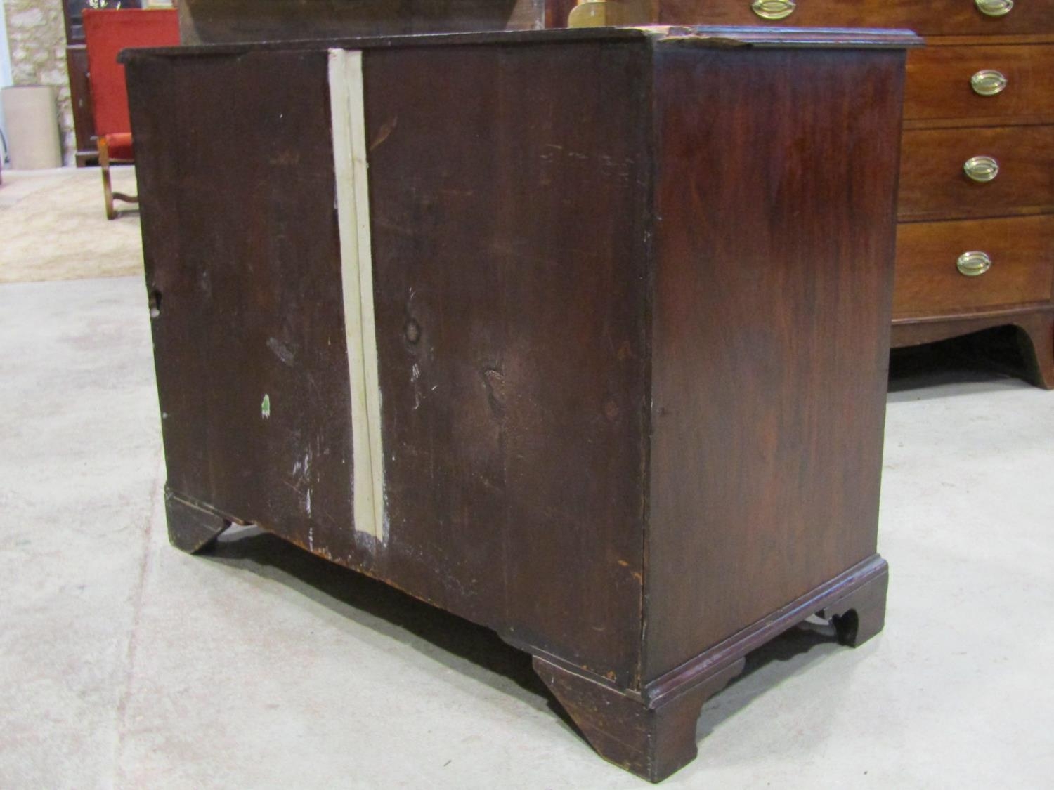 A Georgian mahogany bedroom chest of three long and two short graduated drawers set on bracket feet, - Image 3 of 3