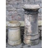 A well weathered clay chimney pot of octagonal form 90 cm high, together with a smaller