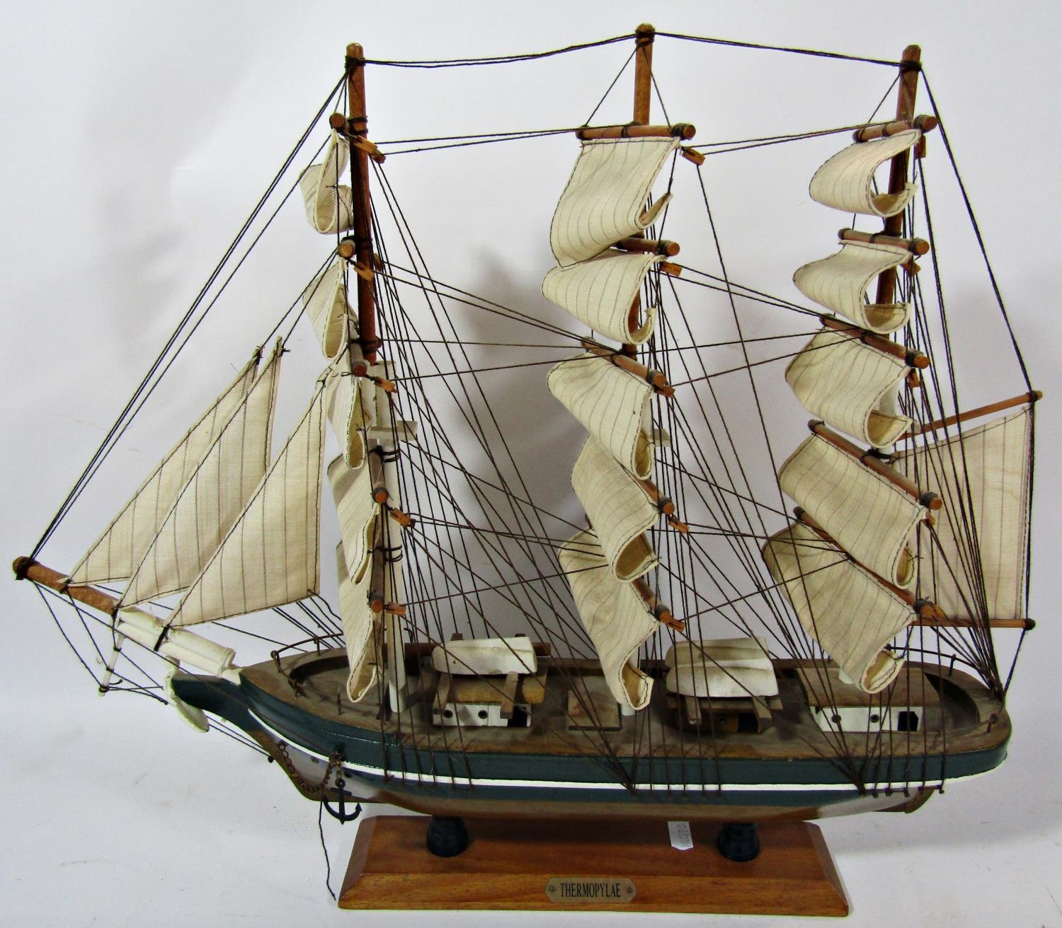 Wooden model of a sailing ship, The Thermopylae, raised on a wooden stand, 53cm long x 44cm high,