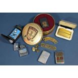 A collection of Zippo lighters with enamel detail Battle of Britain 1940, Dambusters Raid 1943,