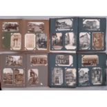 Four post card albums containing black and white postcards in the main French/Belgian, together with