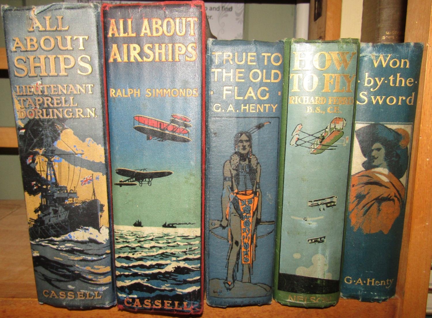 Edwardian boy's books with decorated spines including All About Airships by Ralph Simmonds 1918