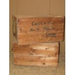 Two rustic pine packing crates with rope handles and hand painted lettering 'Capt C W Peat Household