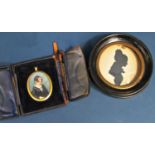 Two Edwardian silhouette portraits, circular frame and a small oval portrait, young woman with