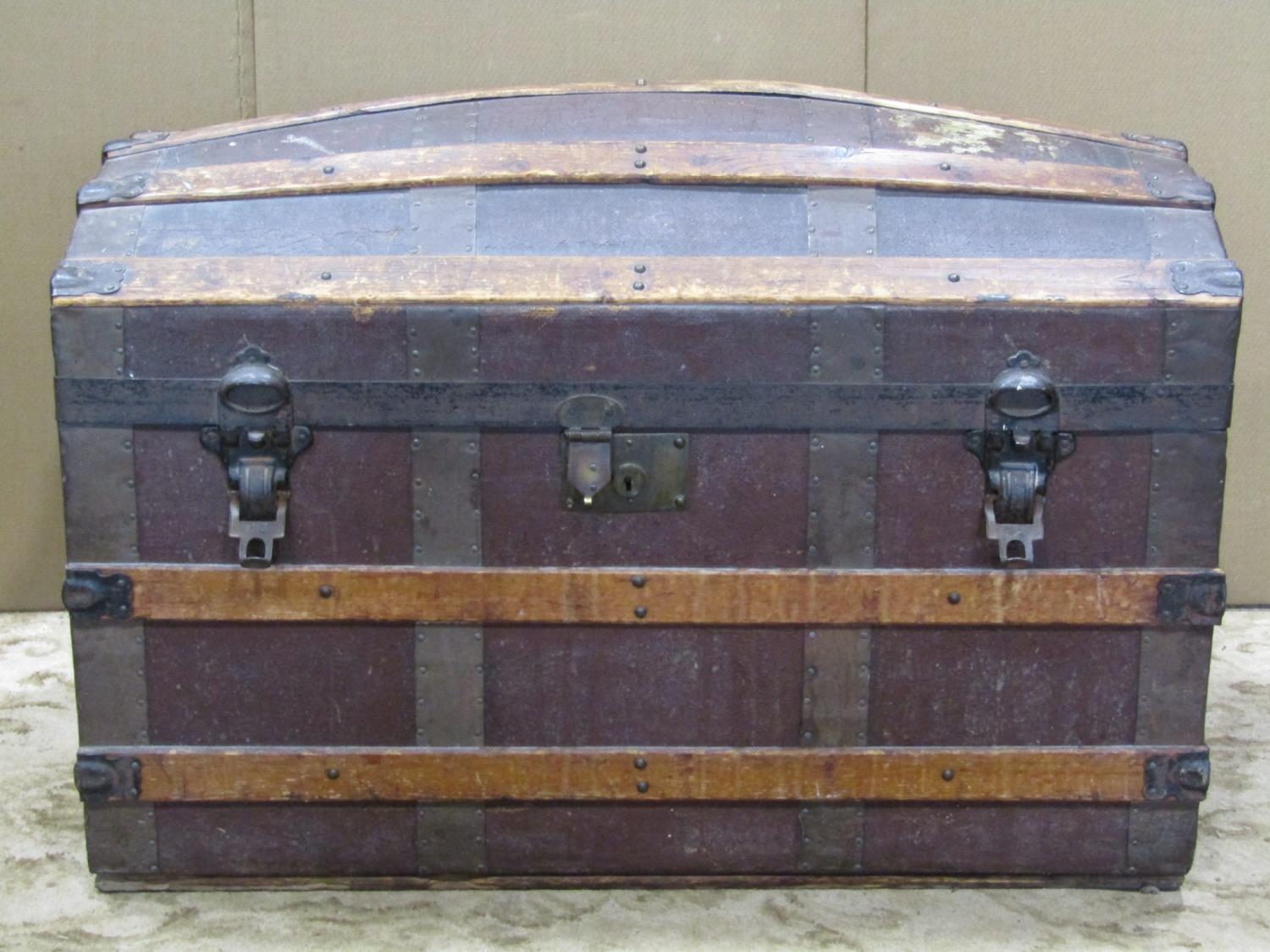 A vintage lathe bound domed top travelling trunk 82 cm long x 45 cm deep x 55 cm high, together with