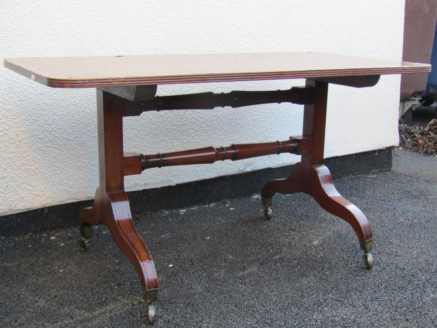 A rectangular occasional table in the regency style, principally in mahogany with burr elm