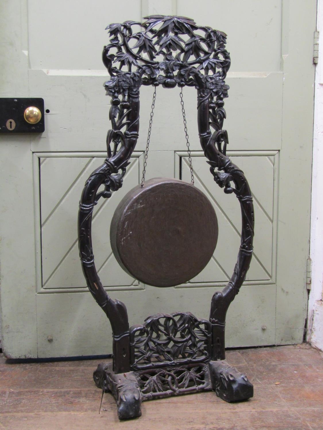 19th century Chinese hardwood floorstanding house gong frame, with carvings of fruits, leaves,