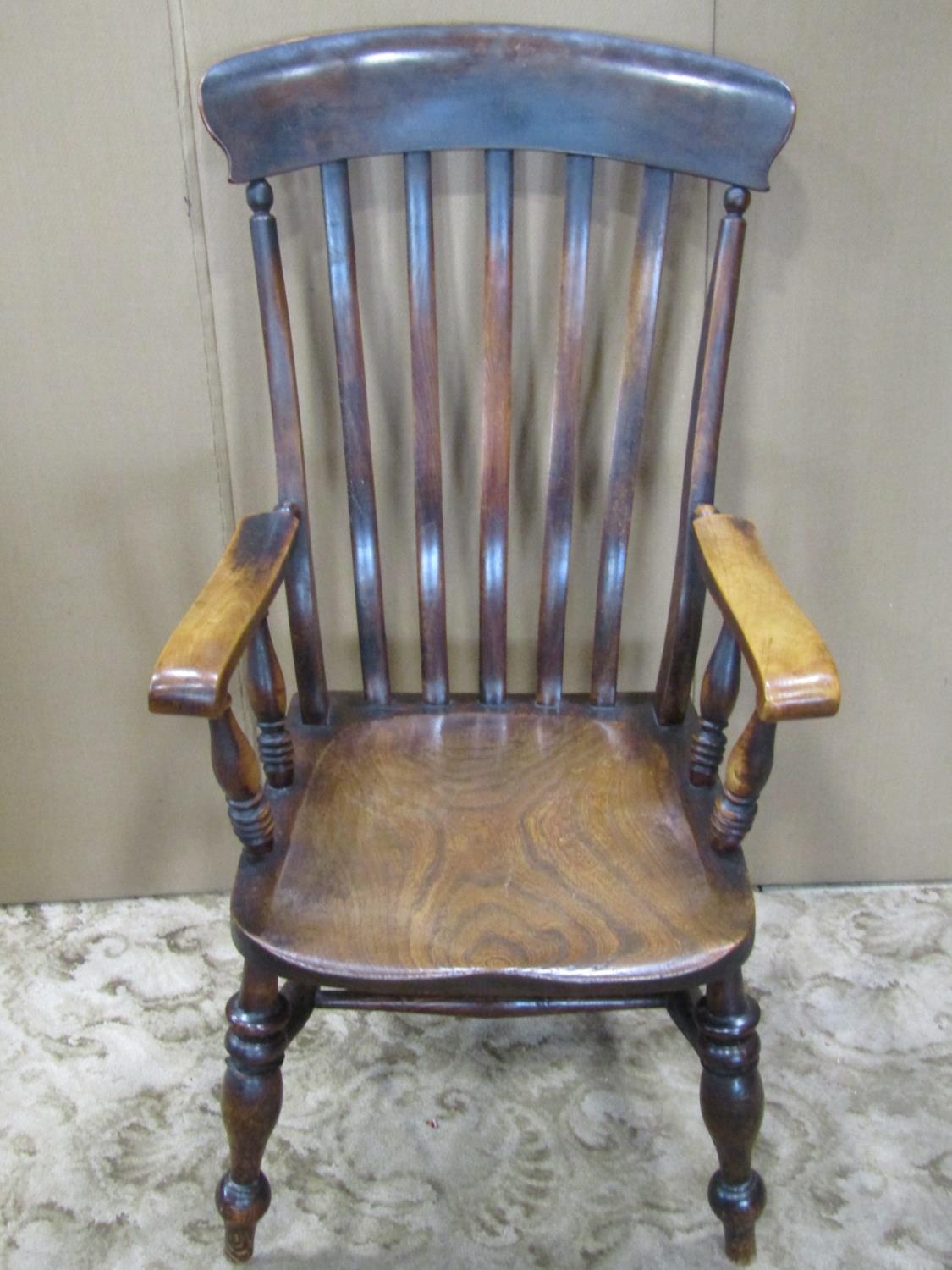 A Windsor stained elm and beechwood lathe back armchair raised on turned supports and stretchers - Image 2 of 3