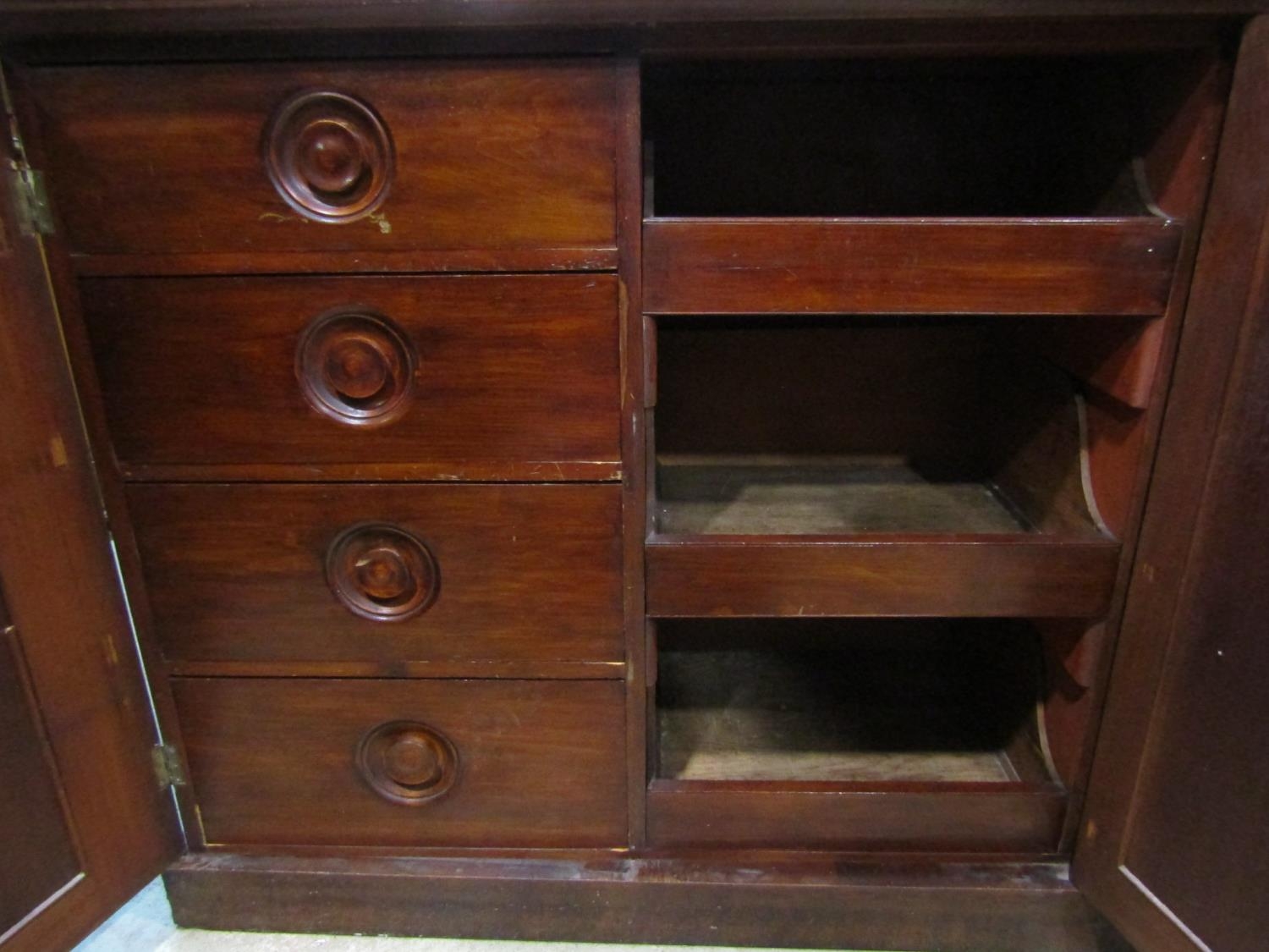 A Victorian mahogany linen cupboard enclosed by three moulded rectangular arched panelled doors, the - Image 4 of 4