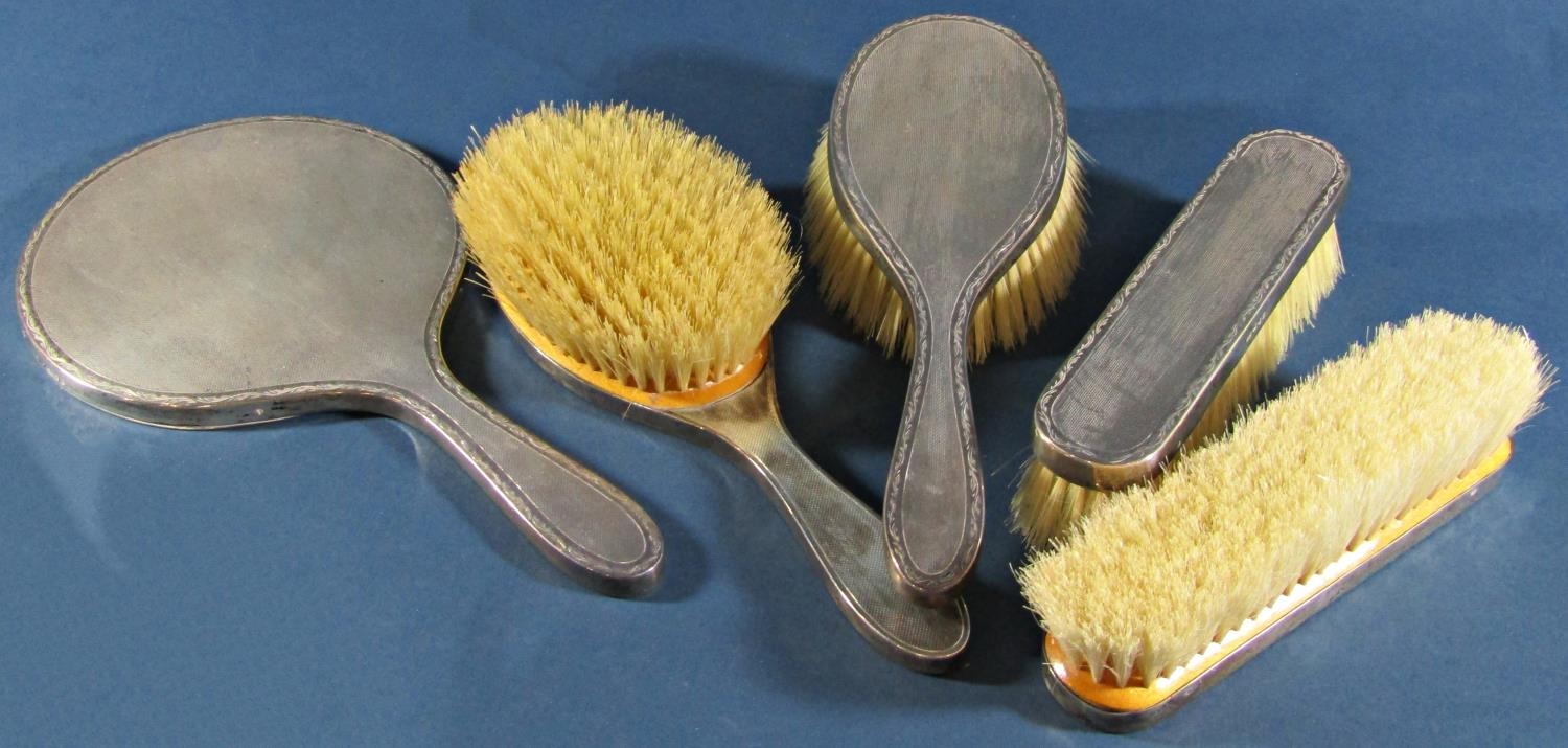 A five piece silver dressing table set comprising hand mirror, two hair brushes and two clothes - Image 2 of 4