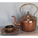 19th century copper kettle with loop handle, further hammered arts and crafts dish, and a small