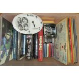 A collection of Beatles memorabilia including a number of books with a bias towards John Lennon