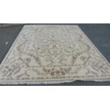 A large Indian made carpet Royal Tabriz style, with a floral pattern on a creamy white ground, 305cm