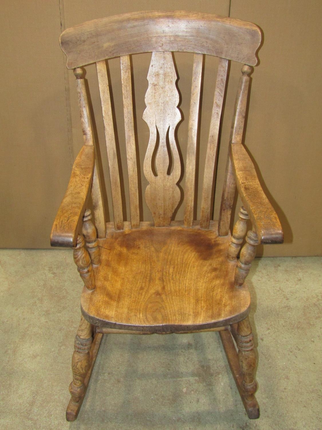 A Windsor stained elm and beechwood lathe back rocking chair with pierced fiddle splat - Image 2 of 2