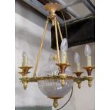 A decorative reproduction cast gilt metal framed hanging ceiling light with pierced scrolling