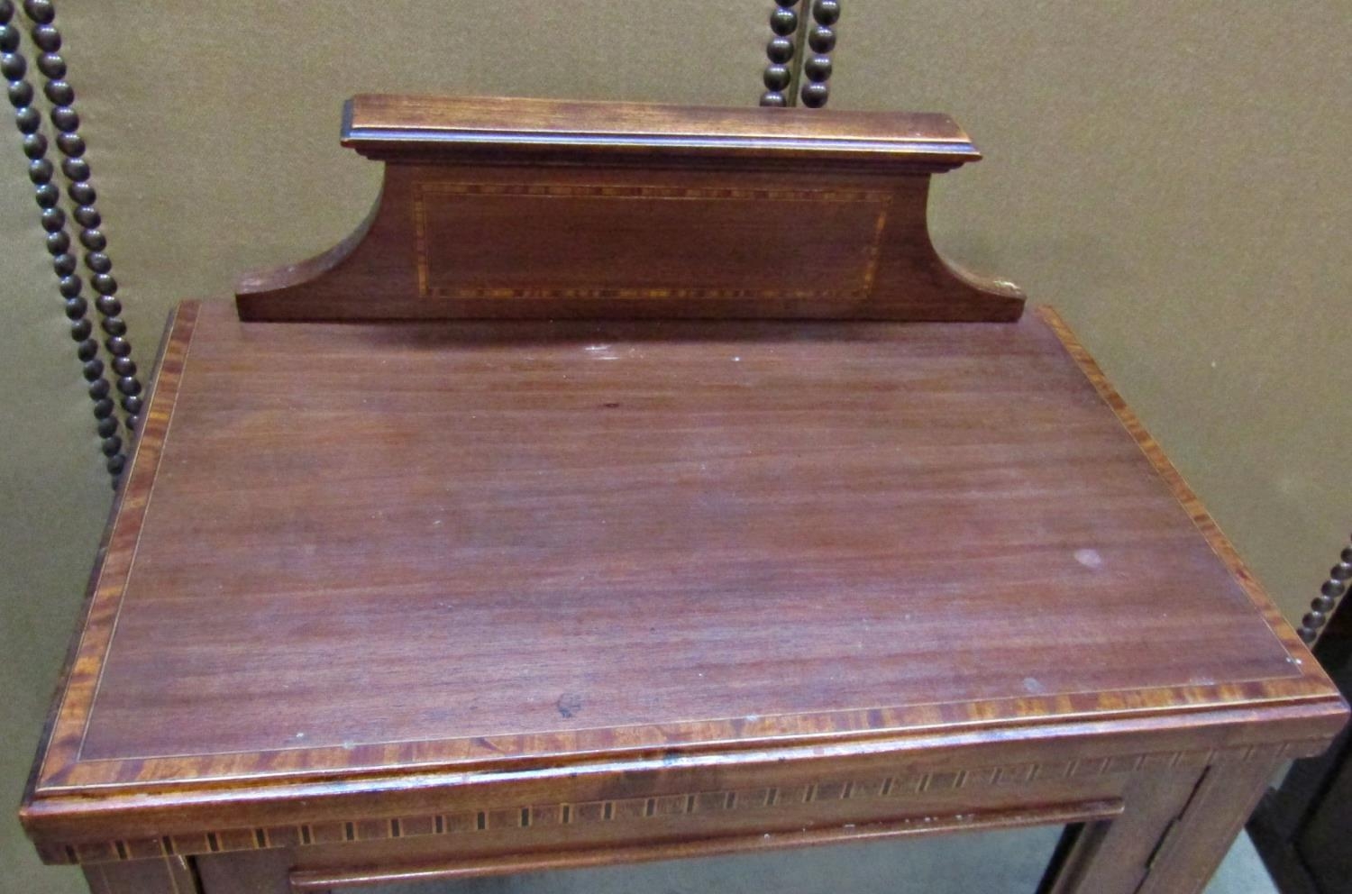 An inlaid Edwardian mahogany side/music cabinet enclosed by two panelled doors, the upper glazed, - Image 2 of 3