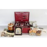 A vintage travelling toilet set in a maroon leather case, oak tea canister, quantity of coinage, etc