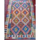 A Chobi Kilim with a multi coloured geometric pattern, 146cm x 99cm ap[prox.