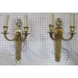 A pair of cast and gilded brass two branch wall lights in a Regency style, 35cm high