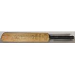 A cricket bat signed by members of the Gloucestershire and Middlesex cricket teams and the