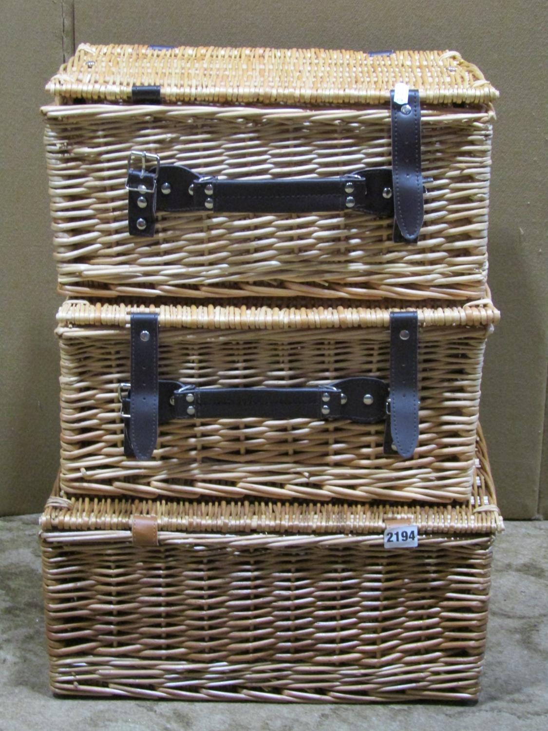 Three small wicker picnic baskets