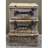 Three small wicker picnic baskets