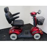 A TGA mobility scooter year of production 2017 in a red colourway complete with charger and keys (