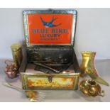 A Bluebird toffee tin containing brass money box, Victorian brass shoe ornaments, very small