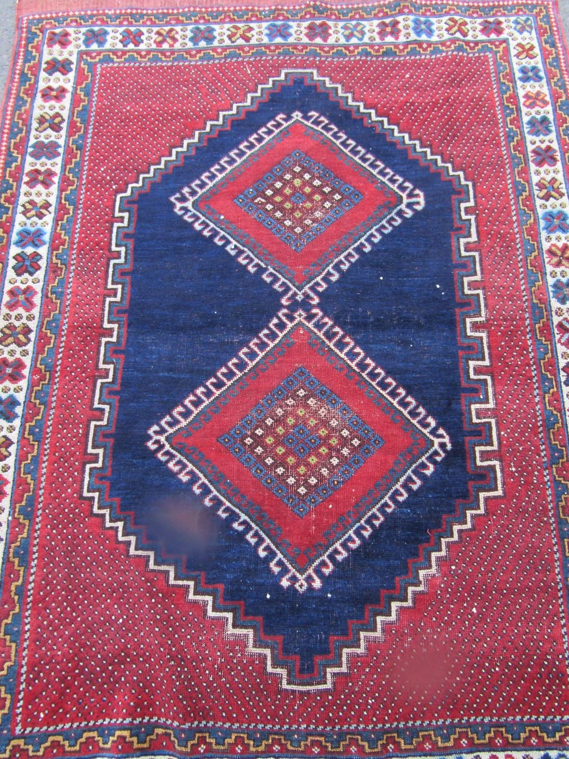 An Antique Persian Tribal carpet with two diamond medallions on a blue ground, 178cm x 120cm approx - Image 2 of 3