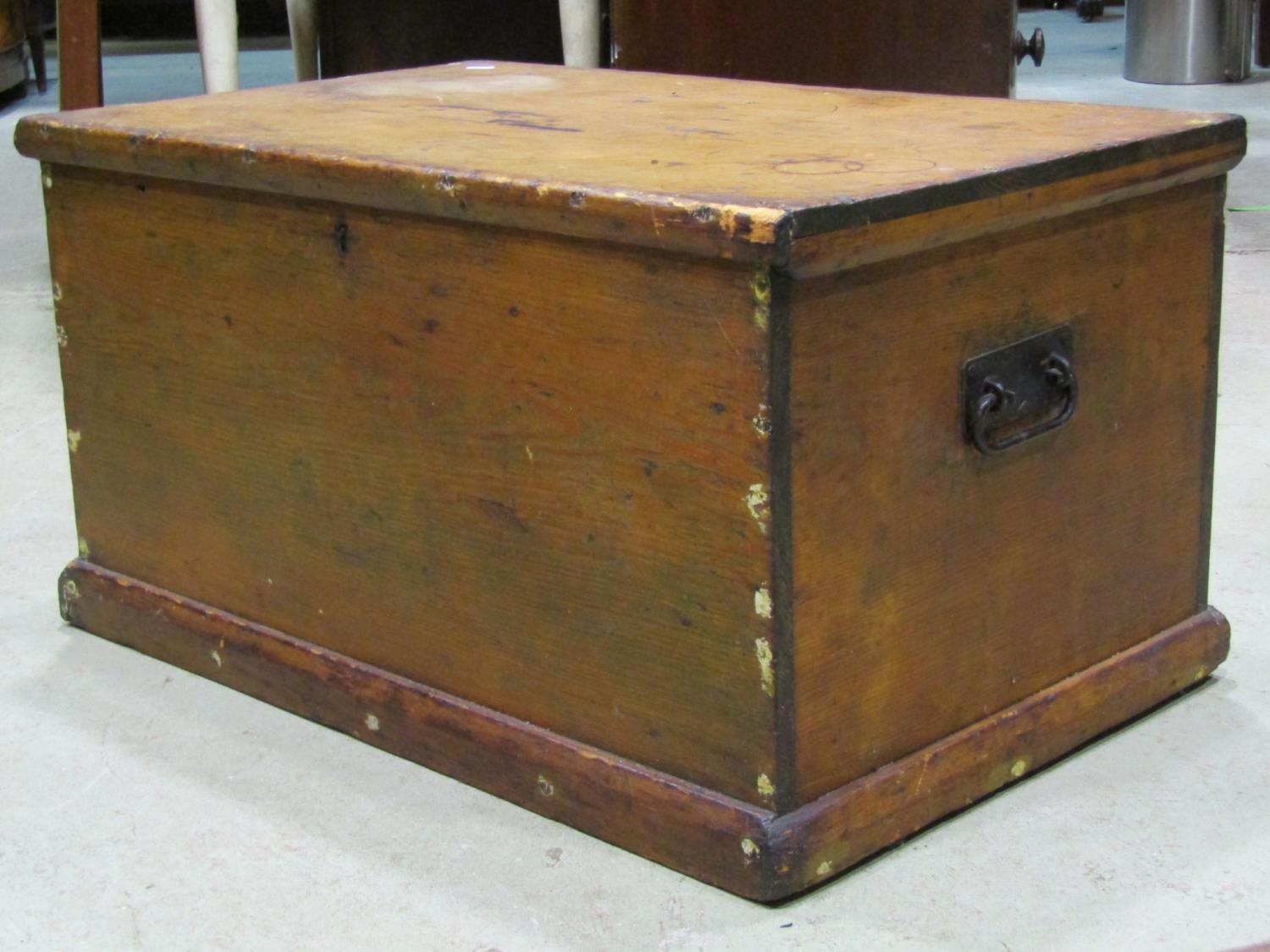 A 19th century pine blanket box with hinged lid and drop side iron work carrying handles, 80 cm wide