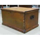 A 19th century pine blanket box with hinged lid and drop side iron work carrying handles, 80 cm wide